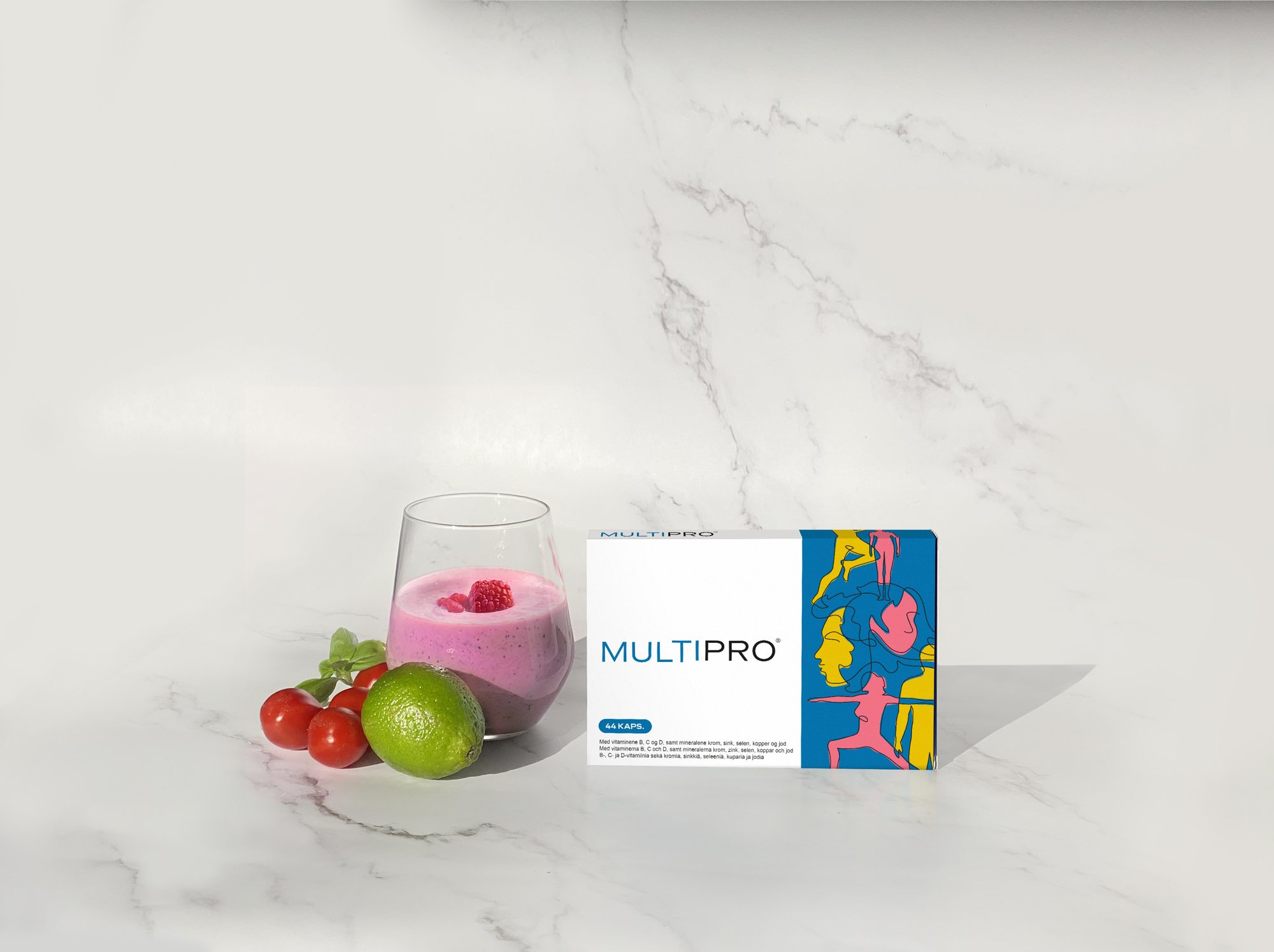 MultiPro pack with a berry smoothie, tomatoes and lime on marble